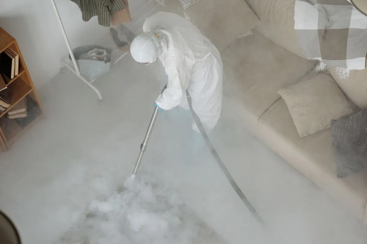 Biohazard cleanup technician in protective equipment, Pennsboro, WV